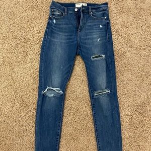 Ripped high rise blue jeans